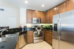 Granite counters and stainless appliances can be found in the kitchen.